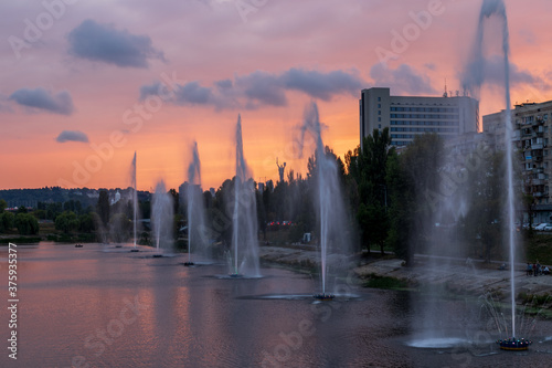 Fountains music light show on Rusanovka channel in Kyiv  Ukraine. Very beautiful fountains with illumination.