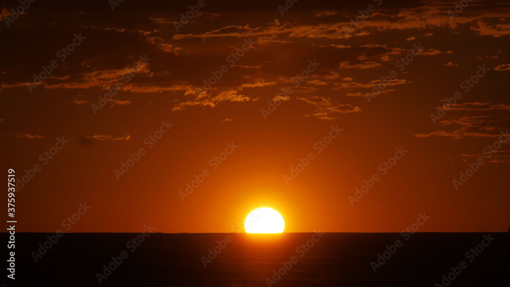 sunset glowing in the desert orange