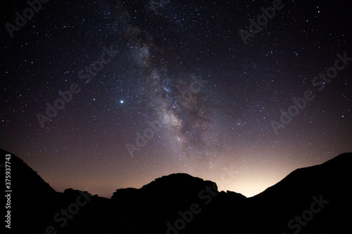 Perfect milky way over a silhouette of mountains in Sierra Nevada, Spain