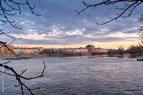Beautiful view of the Vltava river in Prague, Czech Republic at dusk. 
