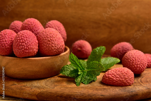 Colorful Natural organic Lychees in a wooden bowl