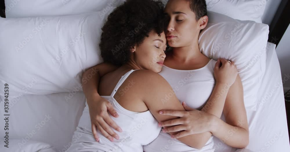 Lesbian couple romancing in bedroom Lesbian couple romancing in bedroom