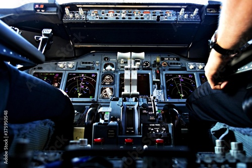 фотографія Aircraft cockpit in flight throttle panel view from the jumpseat