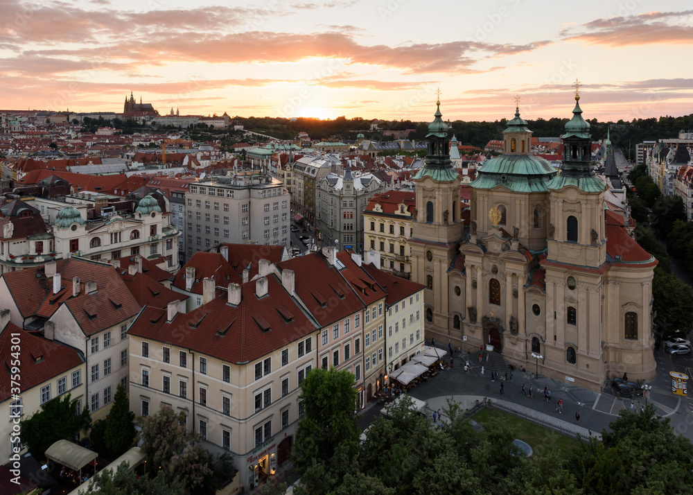 Beautiful evening aerial view of the sunset over the buildings and the historic center of Prague. Czech Republic.
