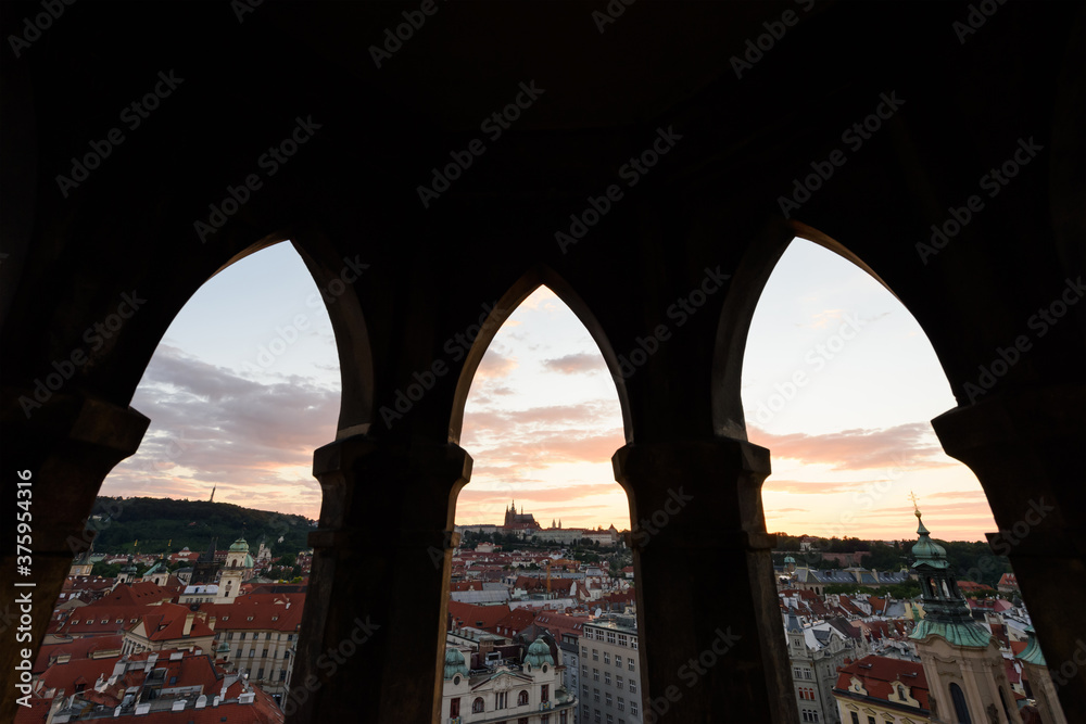 Beautiful evening view from the observation deck on the Clock Tower in the historical center of Prague at dusk. Prague, Czech Republic.