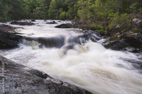 Billede på lærred Water cascades on the river Garry, Scotland, UK