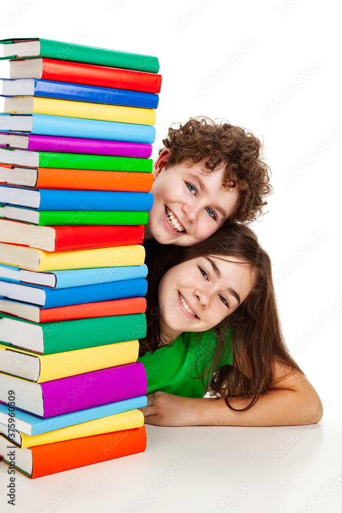 Kids behind pile of books isolated on white background
Kids behind pile of books isolated on white background