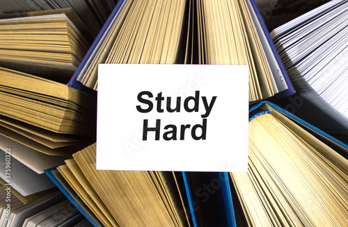 Study hard it written in white note on open books