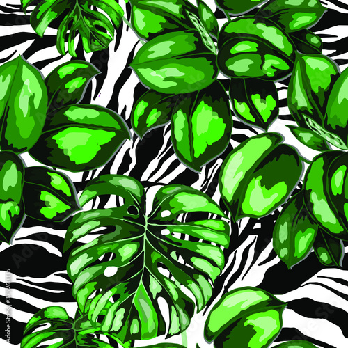 Tropical seamless pattern on animalistic texture. Jungle exotic summer print. Summer tropical leaf. Tropical flower fashion pattern. Floral tropic illustration. Vector seamless pattern.