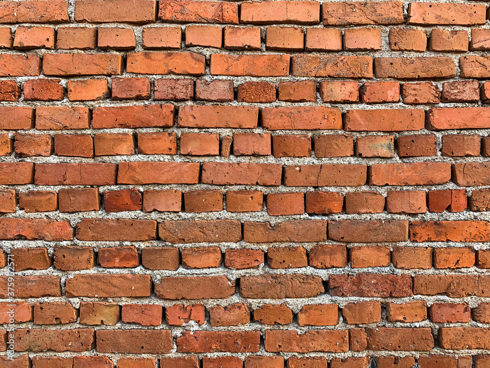 Obraz premium Old brick wall background with cracked and broken bricks