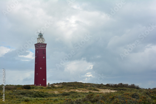 Westhoofd lighthouse in Ouddorp in the Netherlands, in a green landscape and many copy space
