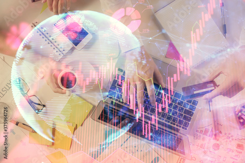 Wallpaper Mural Double exposure of man's hands typing over computer keyboard and business theme hologram drawing. Top view. Financial markets concept. Torontodigital.ca