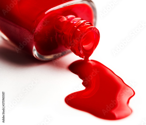 pouring nail polish from bottle