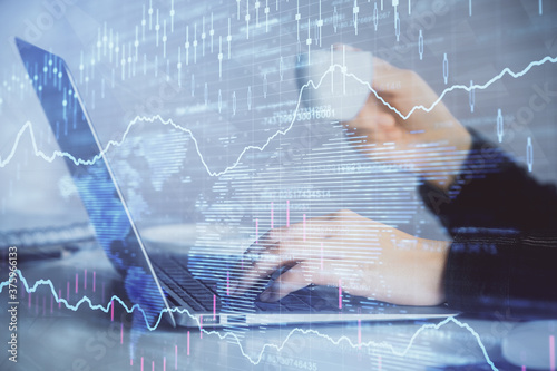 Wallpaper Mural Double exposure of businesswoman hands typing on computer and forex graph hologram drawing. Financial analysis concept. Torontodigital.ca