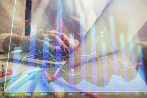 Wallpaper Mural Double exposure of woman hands typing on computer and financial graph hologram drawing. Stock market analysis concept. Torontodigital.ca