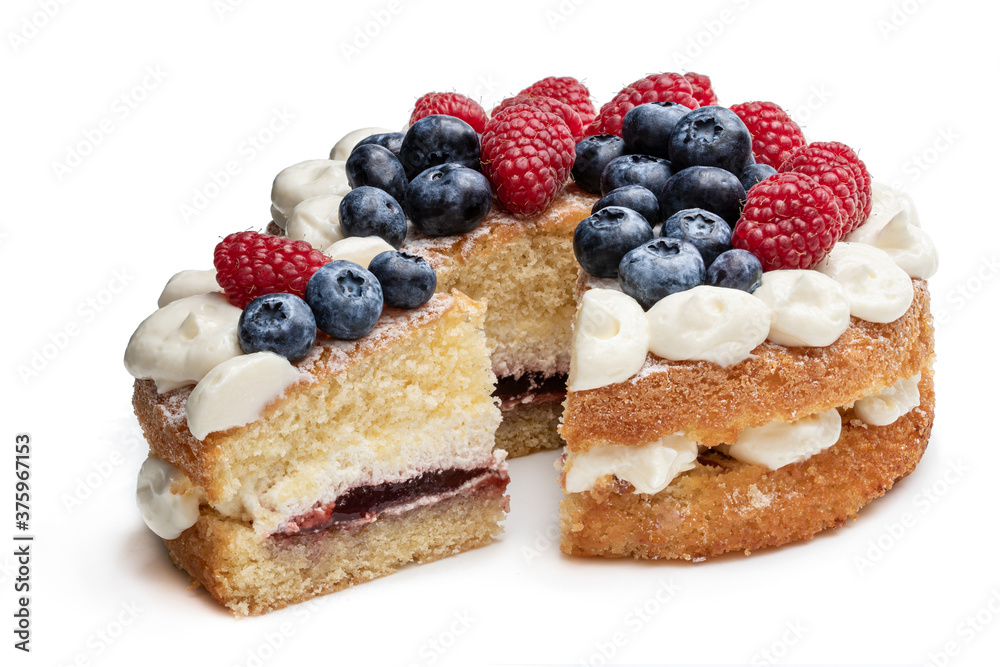 Victoria sponge cake with whipped cream and berries on top isolated on white Victoria sponge cake with whipped cream and berries on top isolated on white