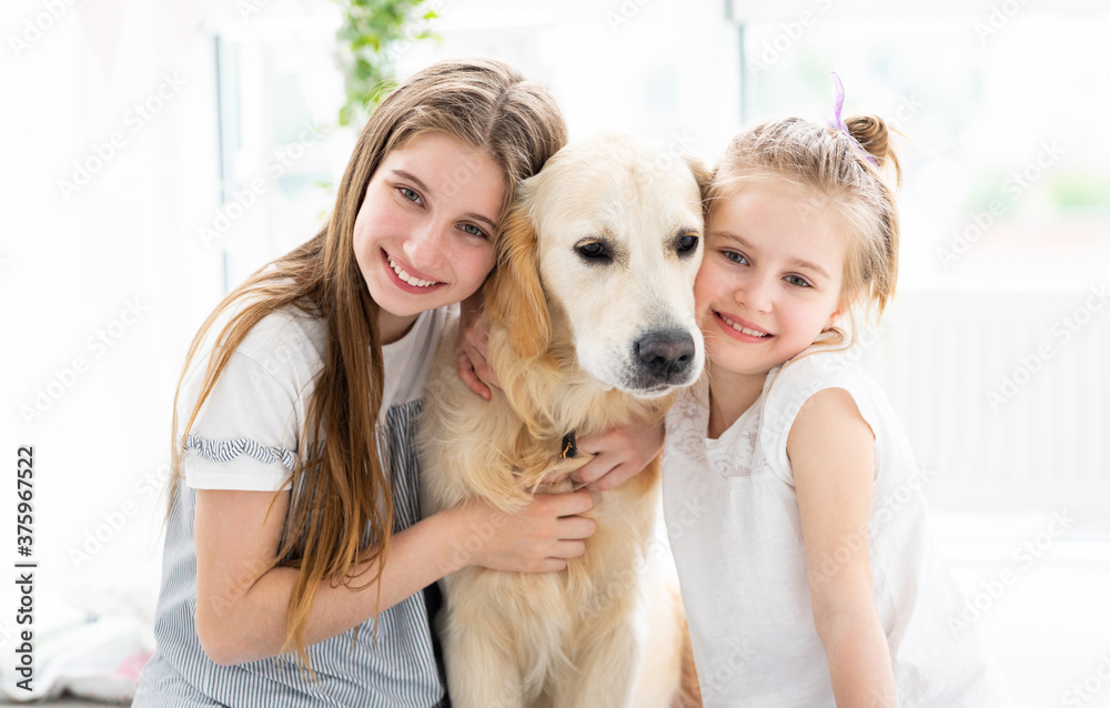 Little girls with cute dog in bright room Little girls with cute dog in bright room