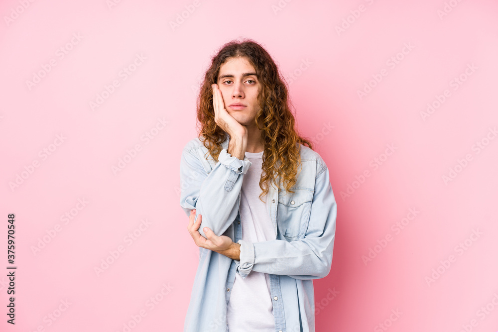 Long hair man posing isolated who is bored, fatigued and need a relax day. Long hair man posing isolated who is bored, fatigued and need a relax day.