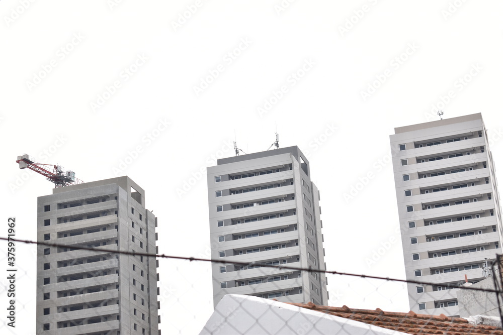 the buildings of the city on a cloudy day