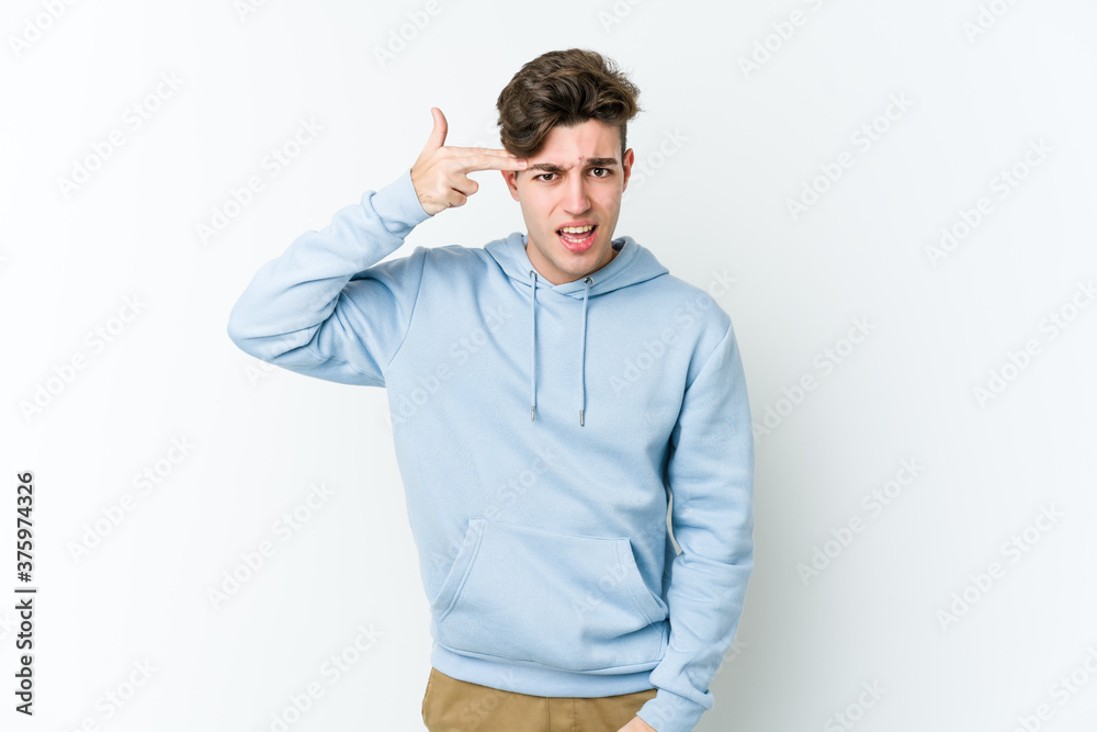 Young caucasian man isolated on white background showing a disappointment gesture with forefinger. Young caucasian man isolated on white background showing a disappointment gesture with forefinger.