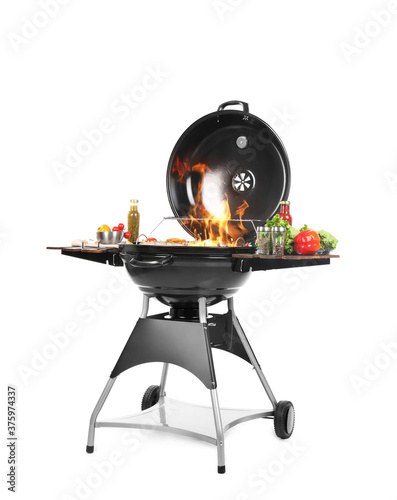 Canvas Print Flaming barbecue grill with cooking meal on white background