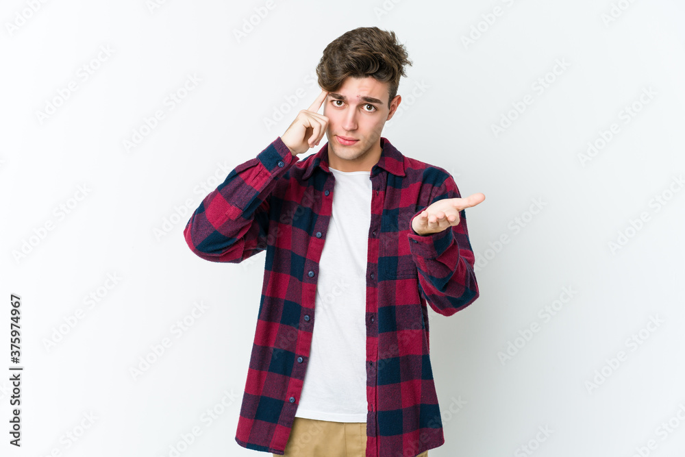 Young caucasian man isolated on white background holding and showing a product on hand. Young caucasian man isolated on white background holding and showing a product on hand.