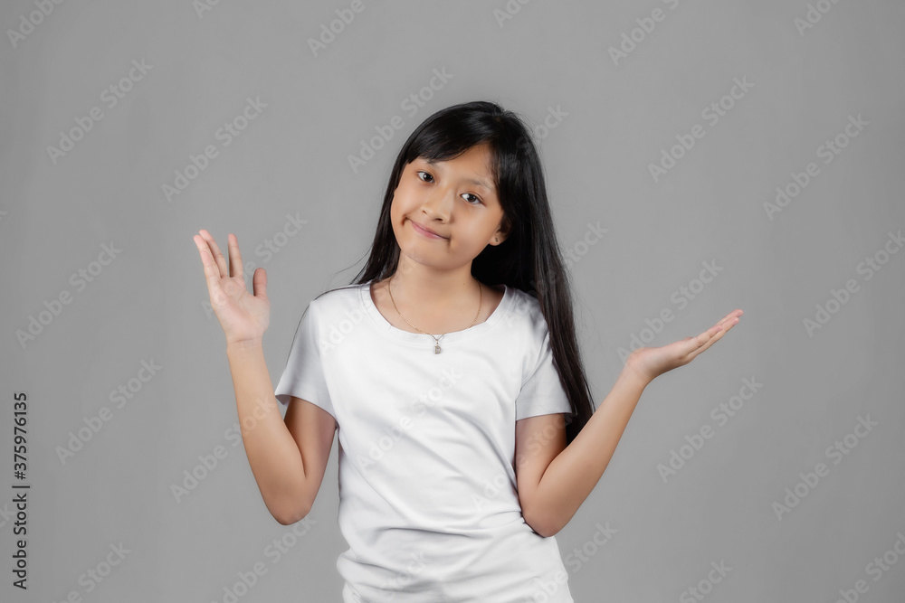 Asian girl studio portrait on gray background Asian girl studio portrait on gray background