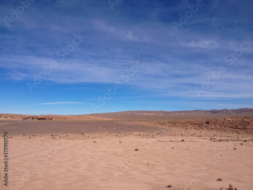 desert sand blue sky clouds