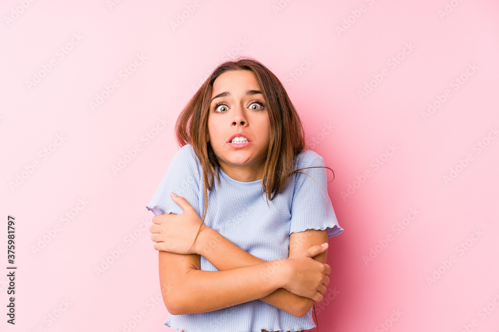 Young caucasian woman wearing a ski clothes isolated going cold due to low temperature or a sickness. Young caucasian woman wearing a ski clothes isolated going cold due to low temperature or a sickness.