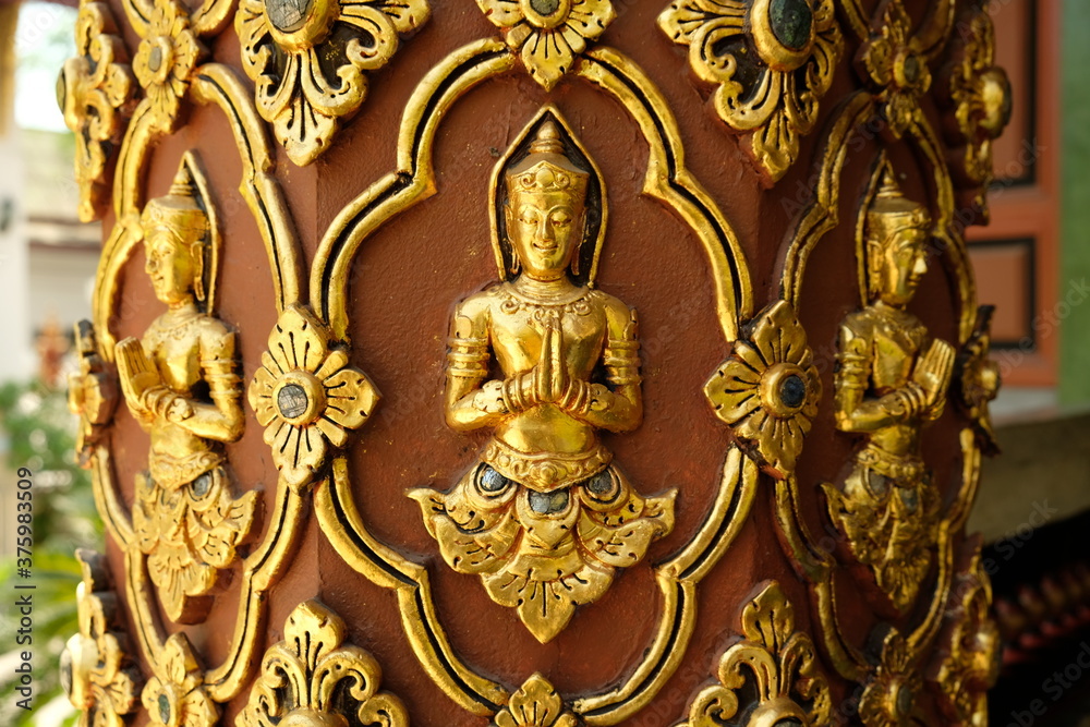 Chiang Mai Thailand - Pillar with golden Buddha in Temple Wat Buppharam