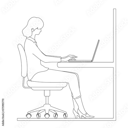 Woman operating a laptop