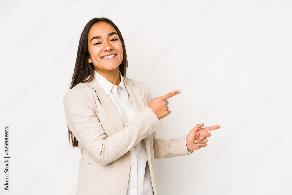 Young woman isolated on a white background excited pointing with forefingers away. Young woman isolated on a white background excited pointing with forefingers away.