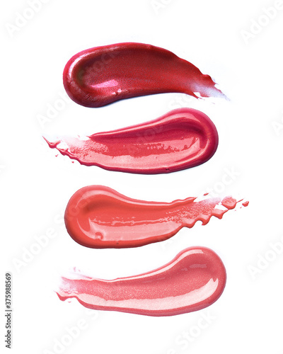 Different lip gloss swatches isolated on white  photo