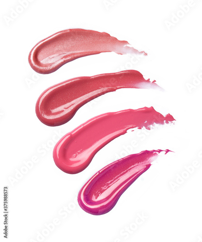 Different lip gloss swatches isolated on white  photo
