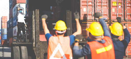 Strike of workers in container yard. Group of multiethnic engineer people during a protest in workplace
