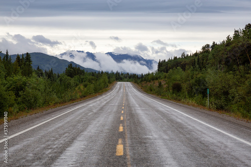 Beautiful View of a scenic road in the Northern Rockies during a sunny and cloudy morning. Taken in British Columbia, Canada. Nature Background © edb3_16