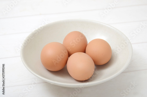 four eggs in a bowl