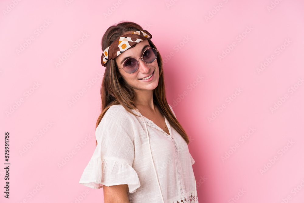 Young hipster caucasian woman isolated looks aside smiling, cheerful and pleasant. Young hipster caucasian woman isolated looks aside smiling, cheerful and pleasant.