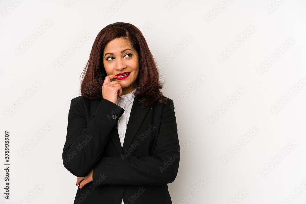 Middle age latin business woman isolated relaxed thinking about something looking at a copy space. Middle age latin business woman isolated relaxed thinking about something looking at a copy space.