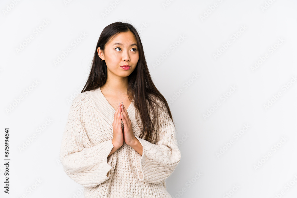 Young chinese woman isolated making up plan in mind, setting up an idea. Young chinese woman isolated making up plan in mind, setting up an idea.