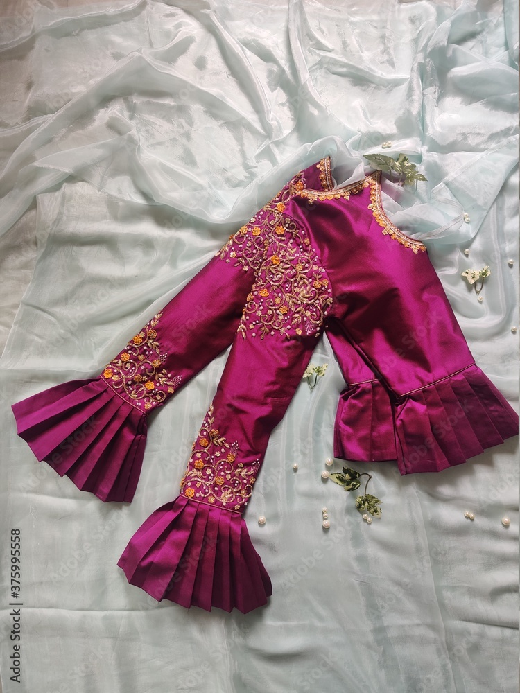 A beautiful dark pink top blouse and embroidered for Indian traditional young woman