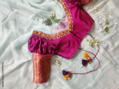 A beautiful blouse design for traditional Indian woman on sari