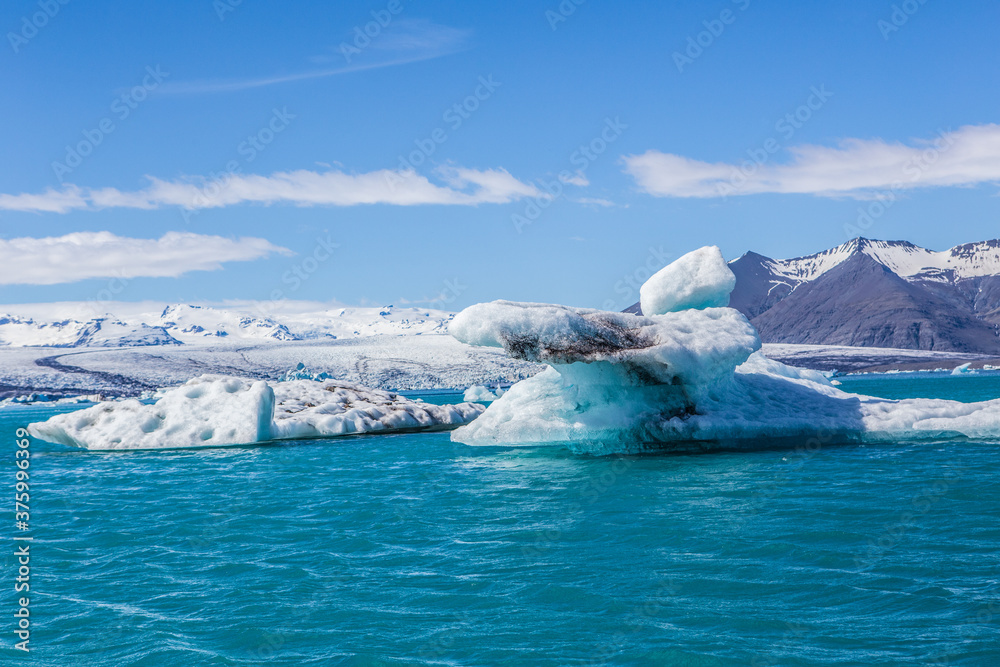 Jokulsarlon Lagoon, a blue glacier lagoon at the south coast of Iceland, on summer time, at a sunny day.