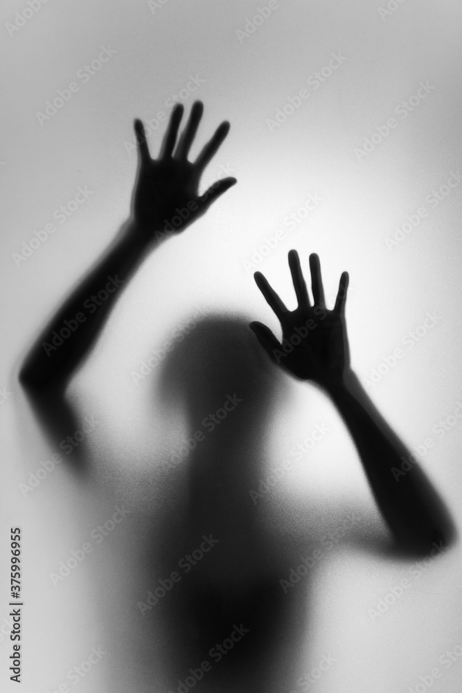 Ghost concept shadow of a woman behind the matte glass blurry hand and body soft focus - obrazy, fototapety, plakaty 