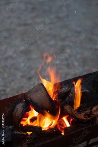 Fire up from charcoal wood outdoor campfire camping. 