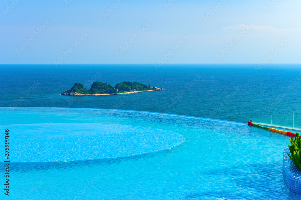 edgeless swimming pool in front of an ocean edgeless swimming pool in front of an ocean