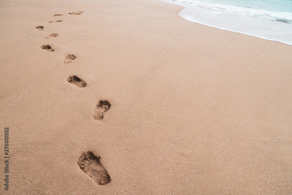 Human footprint on sand summer tropical beach background. Human footprint on sand summer tropical beach background.