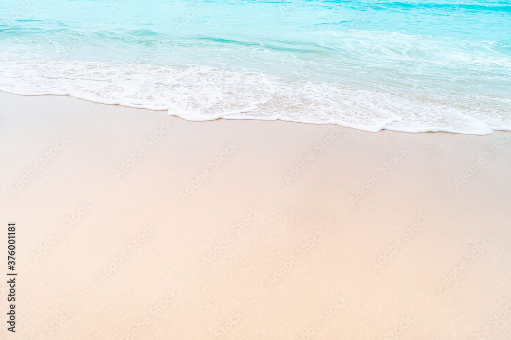 Tropical nature clean beach and white sand in summer with sun light blue sky and bokeh.