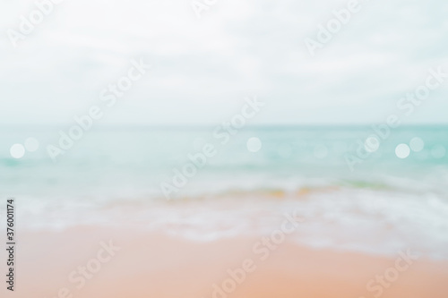 Fototapeta Naklejka Na Ścianę i Meble -  Blur tropical nature clean beach and white sand in summer with sun light blue sky and bokeh