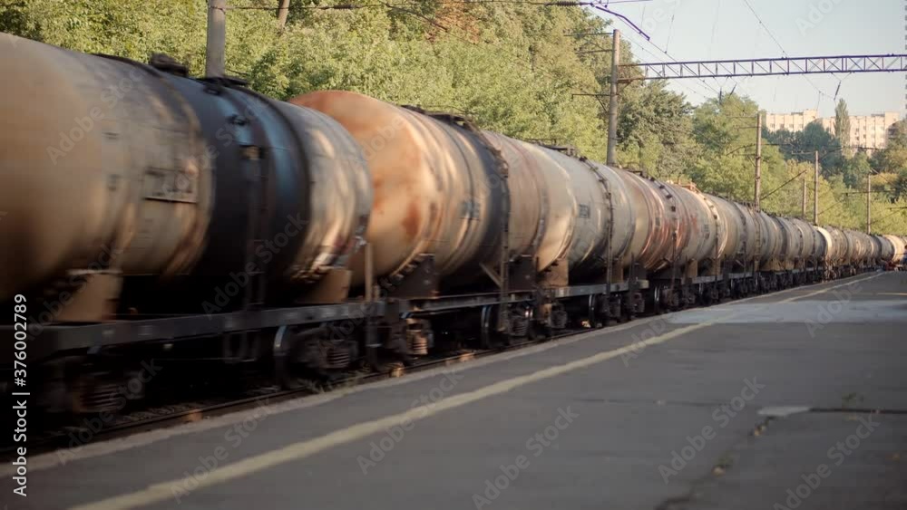 Electric Locomotive With Wagons Rides On Steel Railway.Heavy Industry Transportation Concept.Cargo Train Moving On Platform Staion.Kiev City Logictics.Freight Train Passing Through Passenger Station. Electric Locomotive With Wagons Rides On Steel Railway.Heavy Industry Transportation Concept.Cargo Train Moving On Platform Staion.Kiev City Logictics.Freight Train Passing Through Passenger Station.